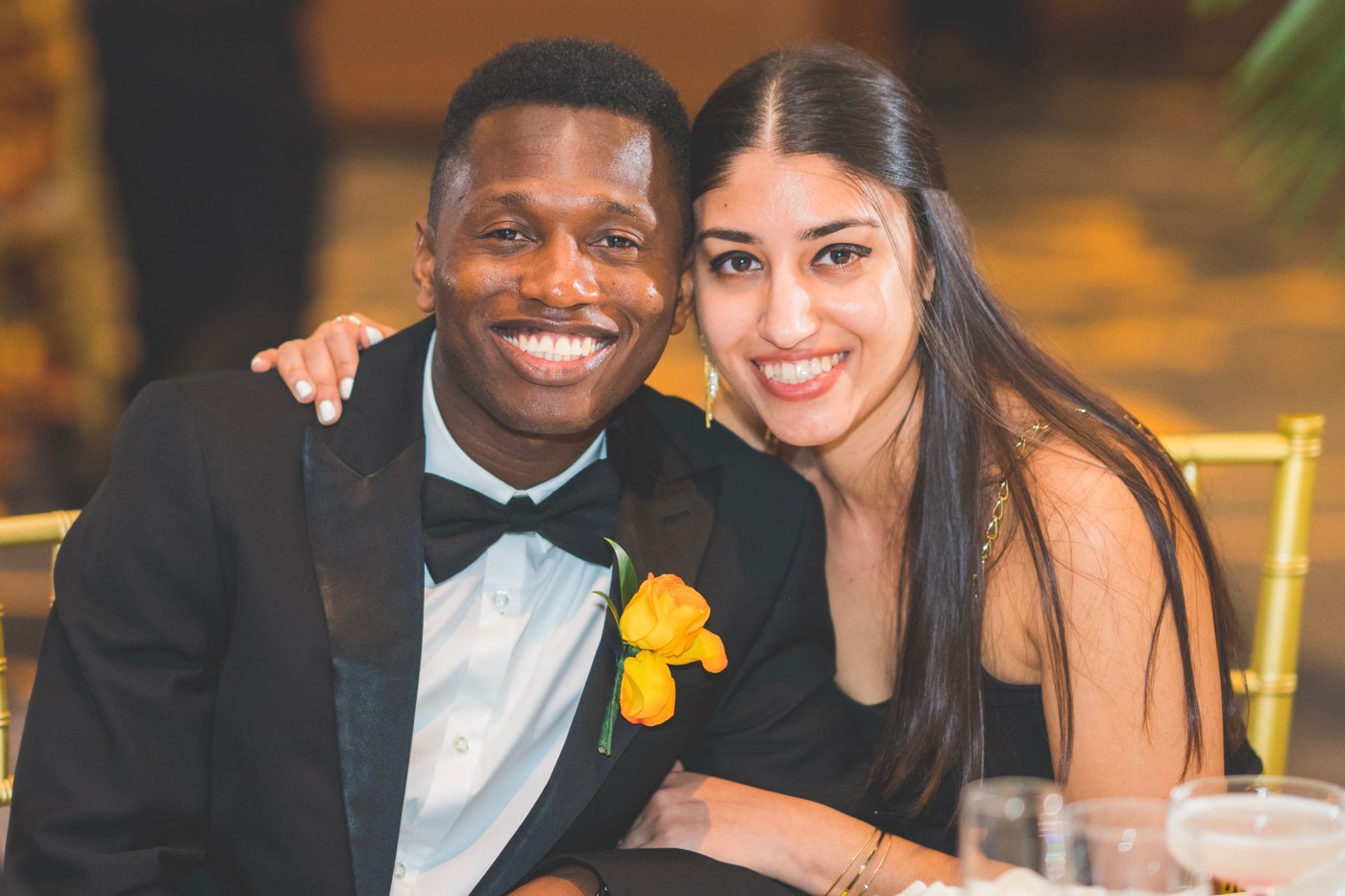 Wari and Alenie Isaac, founders of Cana, seated together at a formal dinner